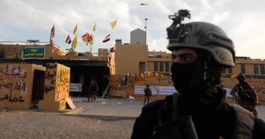 Members of Iraqi security forces in front of U.S. Embassy during a protest, in Baghdad, Iraq, January 1, 2020, photo by Khalid Al Mousily/Reuters