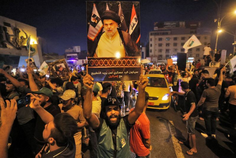 Supporters of Moqtada al-Sadr celebrate in Baghdad.